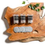 Lotus Vita ENYA half-year replacement bundle, including three filter cartridges and six filter pads, arranged on a rustic wood surface.