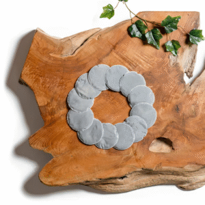 A box of 12 Lotus Vita limescale pads displayed next to two individual white filter pads on a clean background.